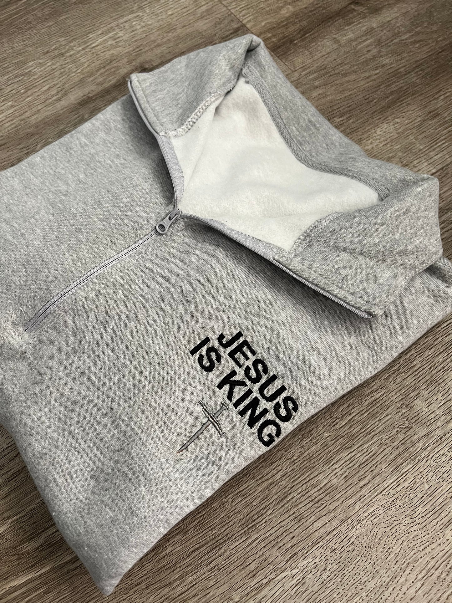Adult Embroidered Jesus is King Quarter zip sweater