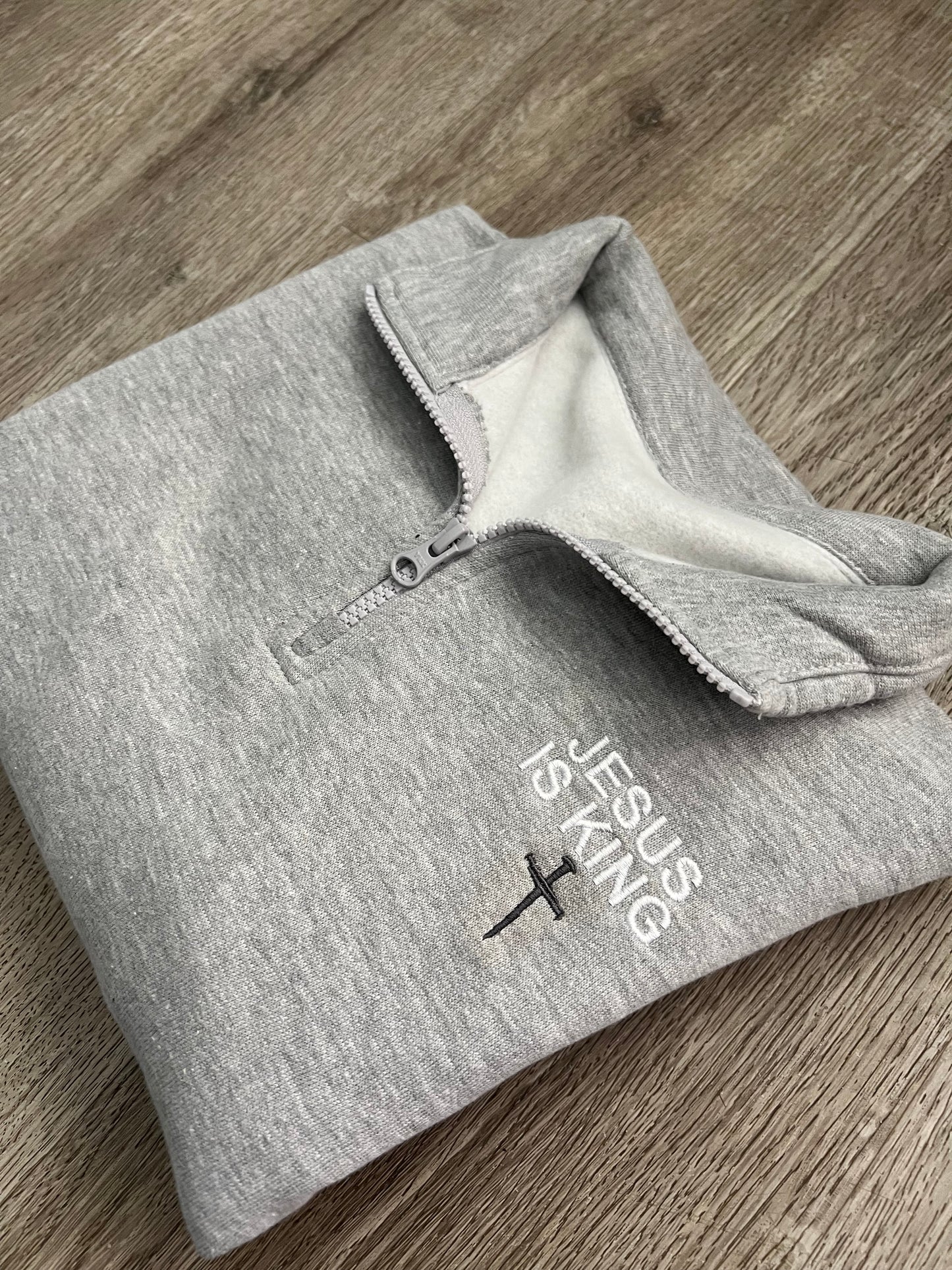 Adult Embroidered Jesus is King Quarter zip sweater